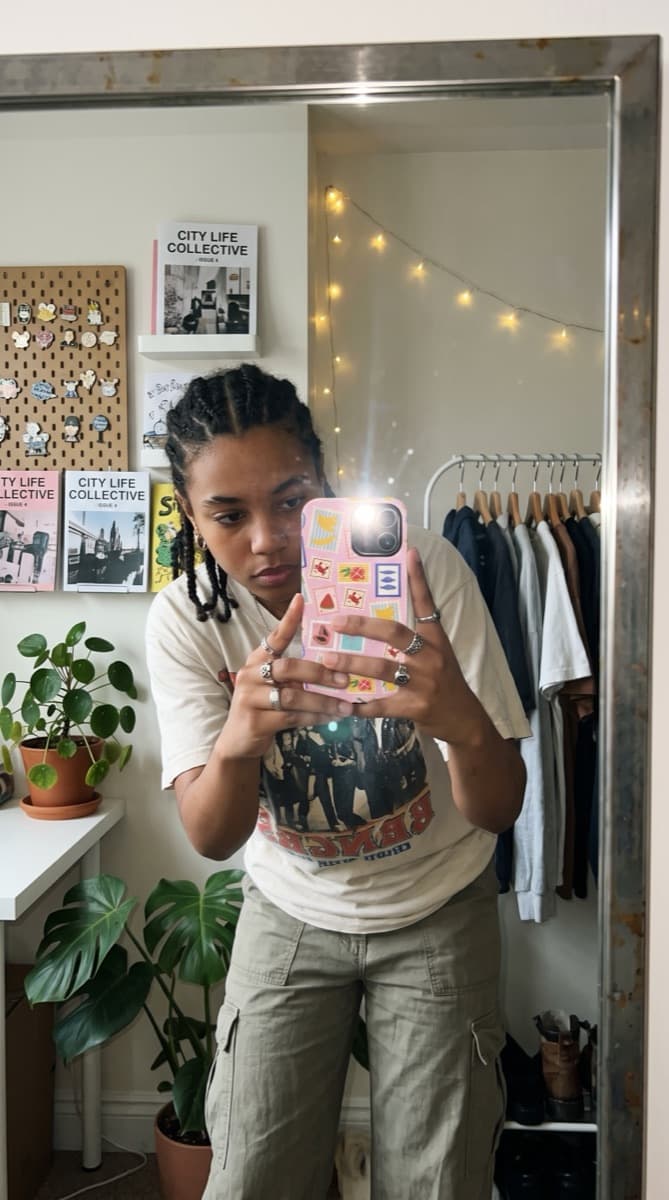 Stamp-pattern Avellé case in a mirror selfie at home